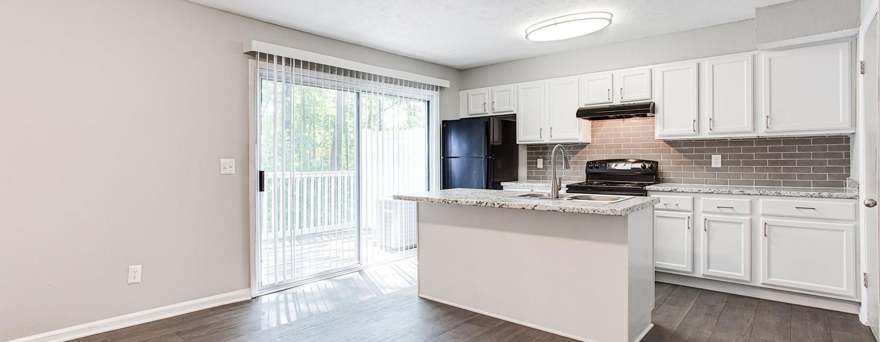 a kitchen with white cabinets