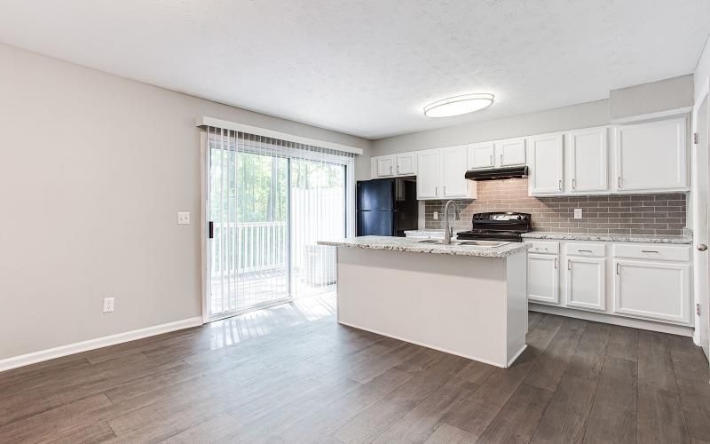 a kitchen with white cabinets