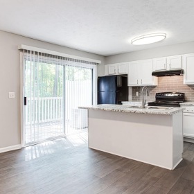 a kitchen with white cabinets