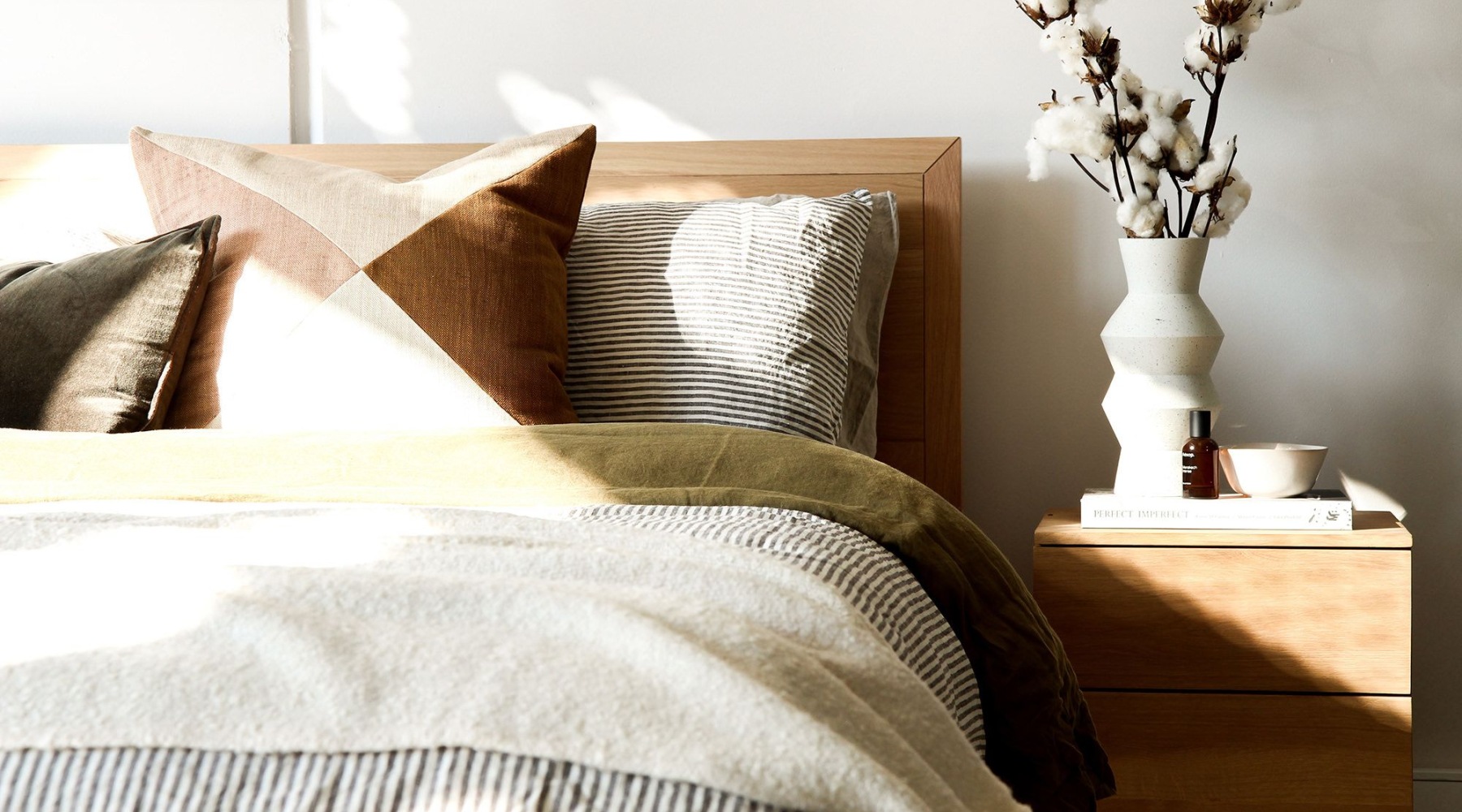 bedroom with bed and lamp and windows